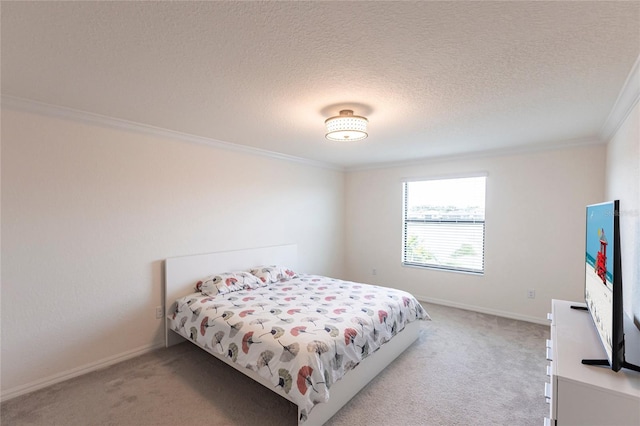 bedroom featuring crown molding, baseboards, and light carpet