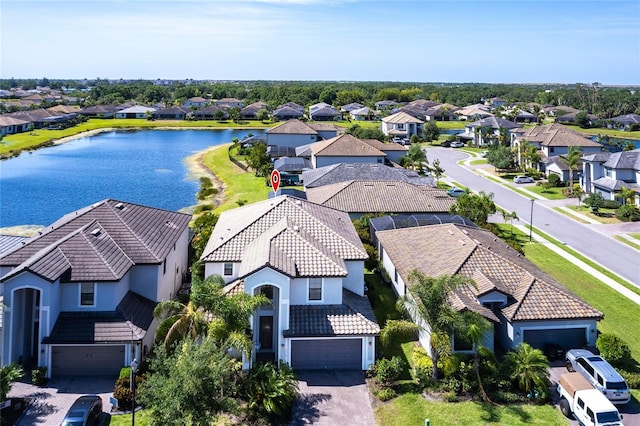 bird's eye view featuring a water view and a residential view