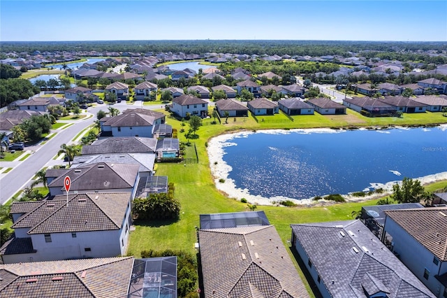 bird's eye view featuring a water view and a residential view