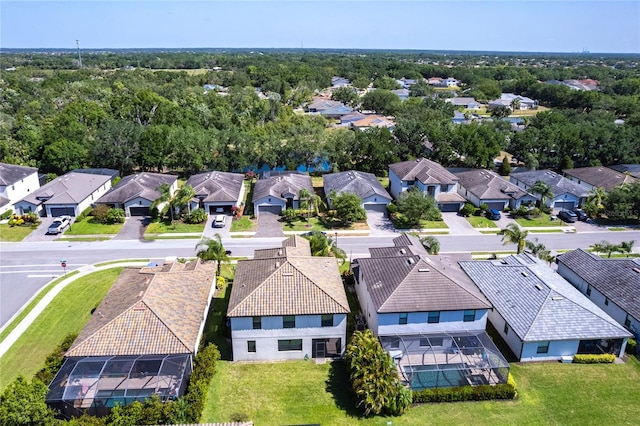 birds eye view of property with a residential view