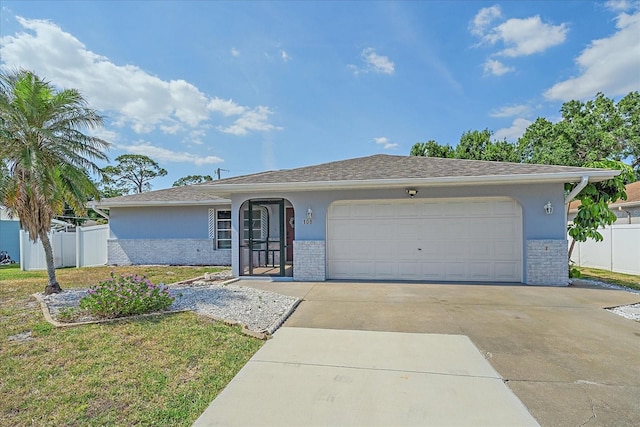 108 Stanford Rd, Venice, FL 34293 - single story home with brick siding, an attached garage, driveway, and stucco siding