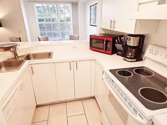 kitchen featuring white appliances, exhaust hood, light countertops, white cabinetry, and a sink