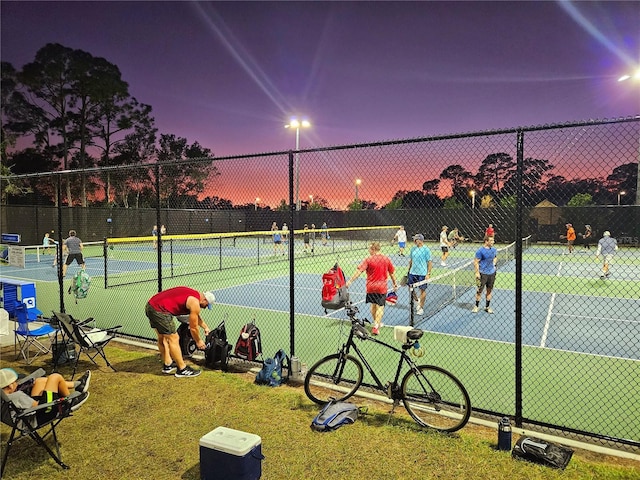 view of tennis court with fence