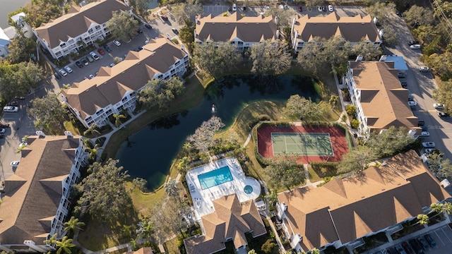 view of property location with a nearby body of water and nearby suburban area