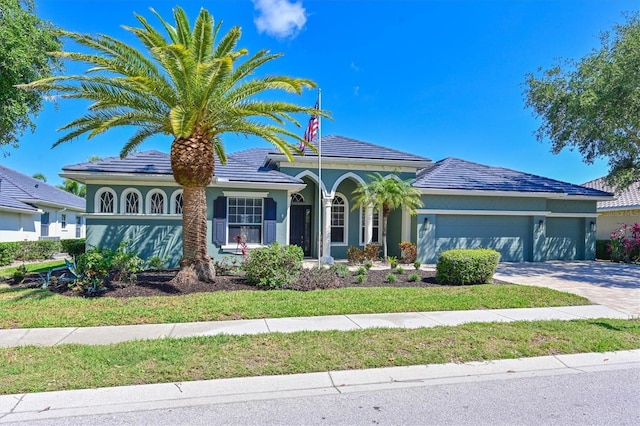 10411 Winding Stream Way, Bradenton, FL 34212 - view of front of property featuring an attached garage, driveway, and stucco siding