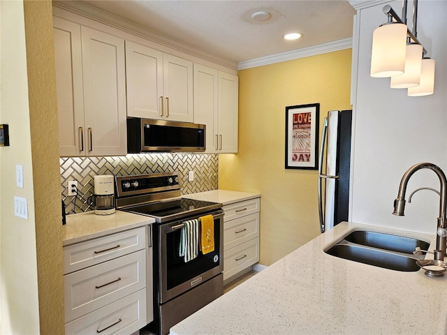850 S Tamiami Trl Unit 529, Sarasota, FL 34236 - kitchen with appliances with stainless steel finishes, a sink, tasteful backsplash, white cabinets, and light stone countertops