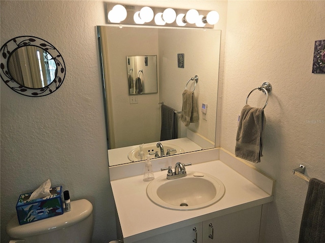 850 S Tamiami Trl Unit 529, Sarasota, FL 34236 - bathroom with toilet, vanity, and a textured wall
