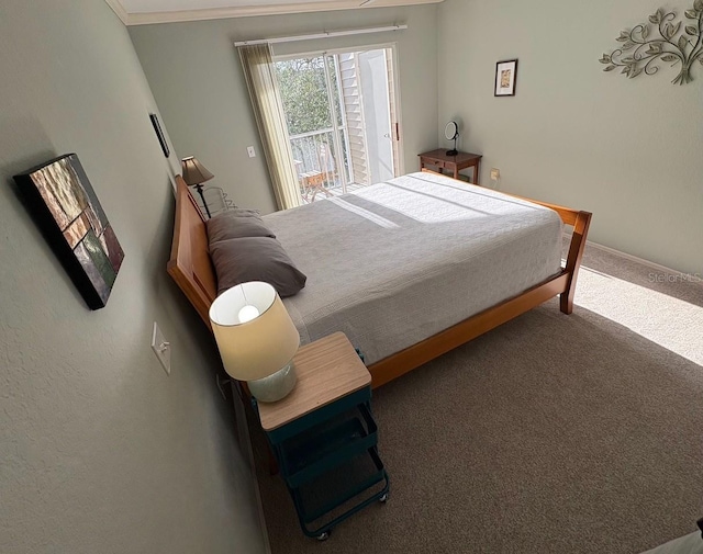 850 S Tamiami Trl Unit 529, Sarasota, FL 34236 - carpeted bedroom featuring access to outside and baseboards