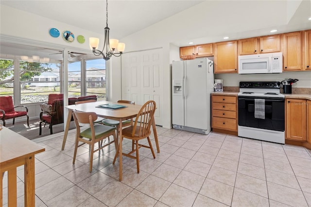 3909 40th St W, Bradenton, FL 34205 - kitchen featuring vaulted ceiling, light countertops, an inviting chandelier, recessed lighting, and white appliances