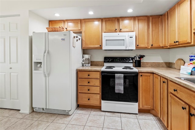 3909 40th St W, Bradenton, FL 34205 - kitchen featuring white appliances, light tile patterned flooring, and light countertops