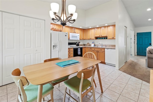 3909 40th St W, Bradenton, FL 34205 - dining space with light tile patterned floors, light carpet, recessed lighting, and a notable chandelier