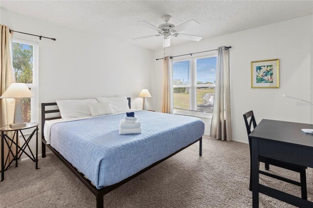 3909 40th St W, Bradenton, FL 34205 - bedroom with a textured ceiling, light carpet, and ceiling fan