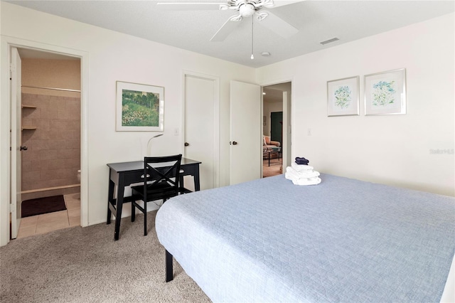 3909 40th St W, Bradenton, FL 34205 - bedroom with light colored carpet, ceiling fan, visible vents, and ensuite bathroom