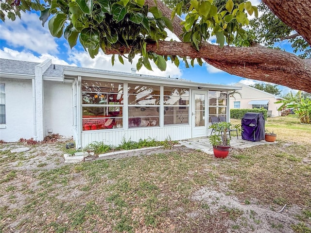 3909 40th St W, Bradenton, FL 34205 - rear view of house featuring a sunroom and a patio area