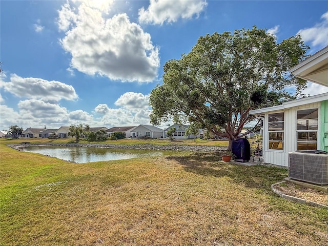 3909 40th St W, Bradenton, FL 34205 - view of yard with a residential view, central AC unit, and a water view