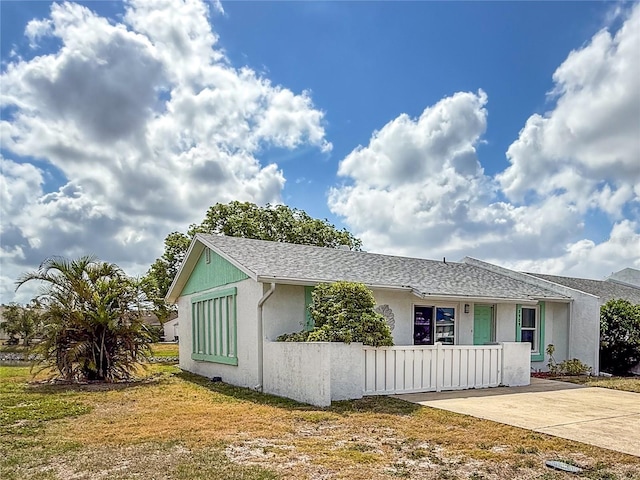 3909 40th St W, Bradenton, FL 34205 - view of front of property with stucco siding and a front lawn