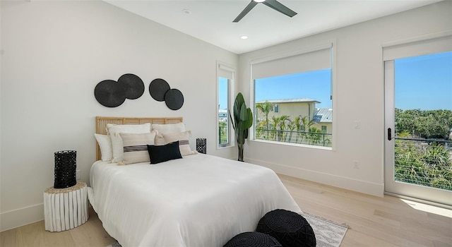 8800 Midnight Pass Rd, Sarasota, FL 34242 - bedroom featuring light wood-style floors, multiple windows, ceiling fan, recessed lighting, and access to exterior