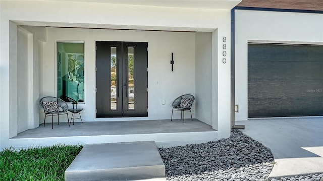 8800 Midnight Pass Rd, Sarasota, FL 34242 - property entrance with french doors and stucco siding