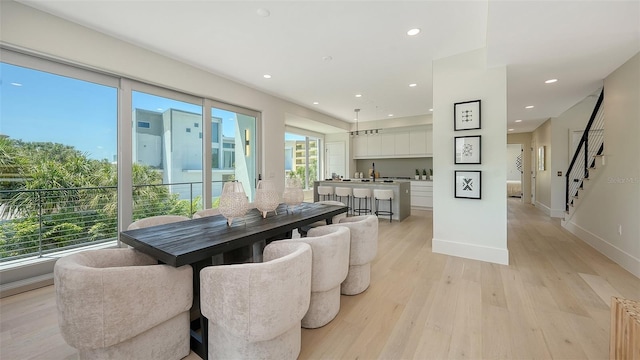 8800 Midnight Pass Rd, Sarasota, FL 34242 - dining area with light wood-style flooring, recessed lighting, and stairs