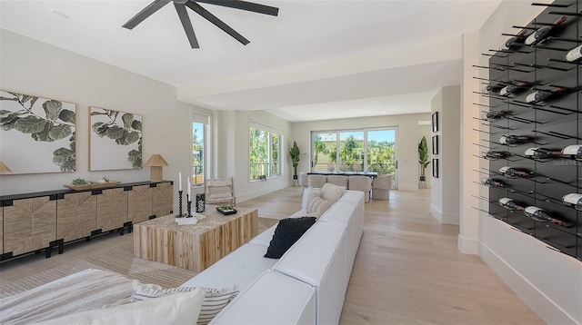 8800 Midnight Pass Rd, Sarasota, FL 34242 - living room featuring light wood finished floors and a ceiling fan