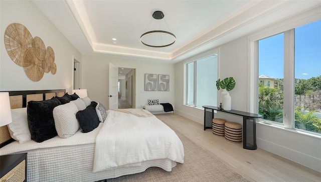 8800 Midnight Pass Rd, Sarasota, FL 34242 - bedroom with wood finished floors and a tray ceiling