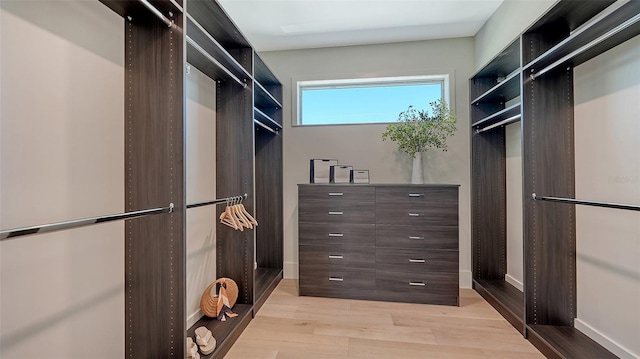 8800 Midnight Pass Rd, Sarasota, FL 34242 - walk in closet with light wood-style floors