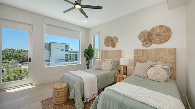 8800 Midnight Pass Rd, Sarasota, FL 34242 - bedroom featuring wood finished floors, multiple windows, recessed lighting, a ceiling fan, and access to exterior
