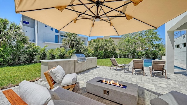 8800 Midnight Pass Rd, Sarasota, FL 34242 - view of patio / terrace featuring an outdoor fire pit, exterior kitchen, and an outdoor pool
