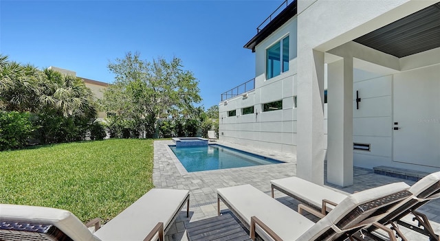 8800 Midnight Pass Rd, Sarasota, FL 34242 - view of pool featuring a lawn, a patio area, and a pool with connected hot tub