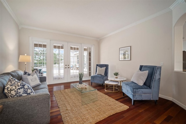 living room with french doors, arched walkways, ornamental molding, and dark wood finished floors