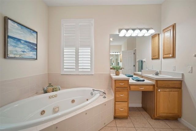 full bath with baseboards, a jetted tub, tile patterned floors, and vanity