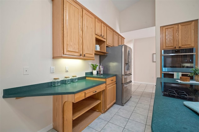 kitchen featuring open shelves, dark countertops, light tile patterned floors, baseboards, and appliances with stainless steel finishes
