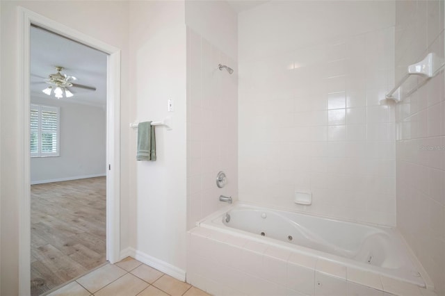 bathroom with tile patterned flooring, a combined bath / shower with jetted tub, baseboards, and ceiling fan