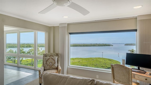 interior space with a water view, plenty of natural light, recessed lighting, and crown molding