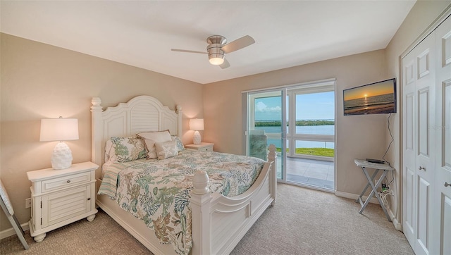 bedroom with access to outside, light carpet, baseboards, and ceiling fan