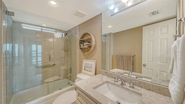 bathroom with toilet, combined bath / shower with glass door, vanity, and recessed lighting