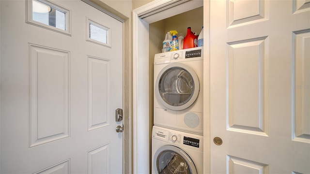 laundry area with stacked washer / dryer