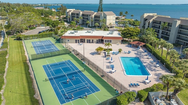 aerial view of a pool and a large body of water