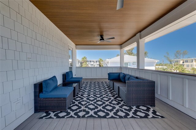 wooden deck featuring an outdoor hangout area and ceiling fan