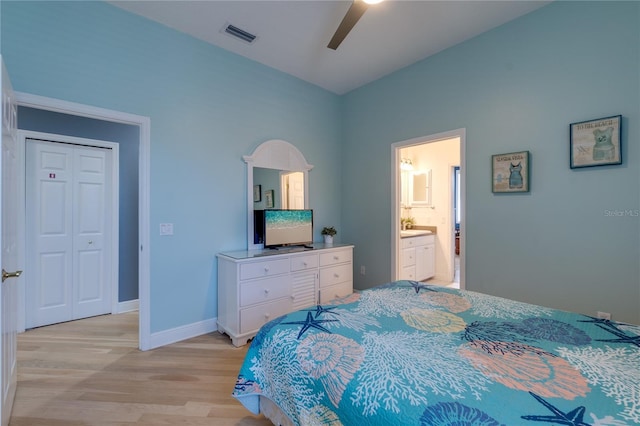 bedroom featuring a ceiling fan, connected bathroom, light wood finished floors, baseboards, and visible vents