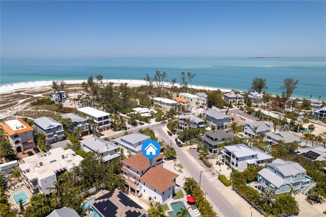 drone / aerial view featuring a view of the beach and a water view
