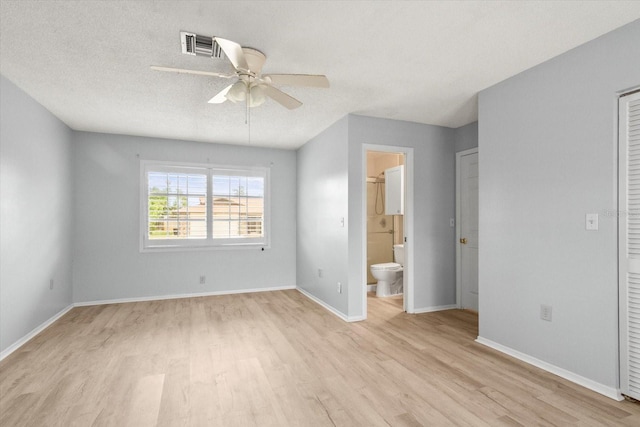 2961 Valencia Rd, Venice, FL 34293 - unfurnished bedroom with baseboards, visible vents, a textured ceiling, and light wood finished floors
