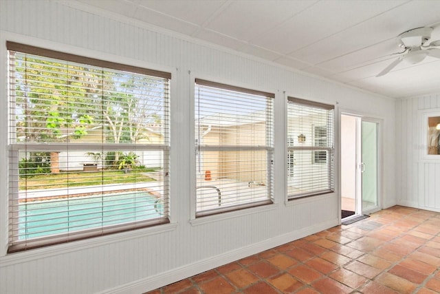 2961 Valencia Rd, Venice, FL 34293 - unfurnished room featuring crown molding, baseboards, ceiling fan, and tile patterned floors