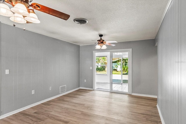 2961 Valencia Rd, Venice, FL 34293 - spare room featuring wood finished floors, a ceiling fan, visible vents, and a textured ceiling