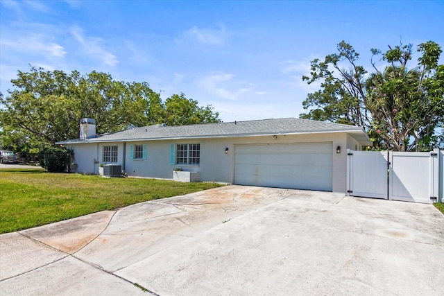 2961 Valencia Rd, Venice, FL 34293 - ranch-style house featuring a gate, a front lawn, central AC, stucco siding, and an attached garage