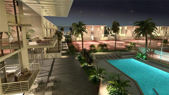 2170 Robinhood St Unit A1-304, Sarasota, FL 34231 - pool at twilight with a community pool and a patio area