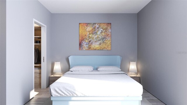 2170 Robinhood St Unit A1-304, Sarasota, FL 34231 - bedroom featuring wood finished floors and a closet