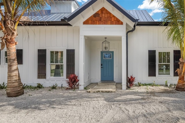 305 73rd St, Holmes Beach, FL 34217 - entrance to property featuring board and batten siding and metal roof