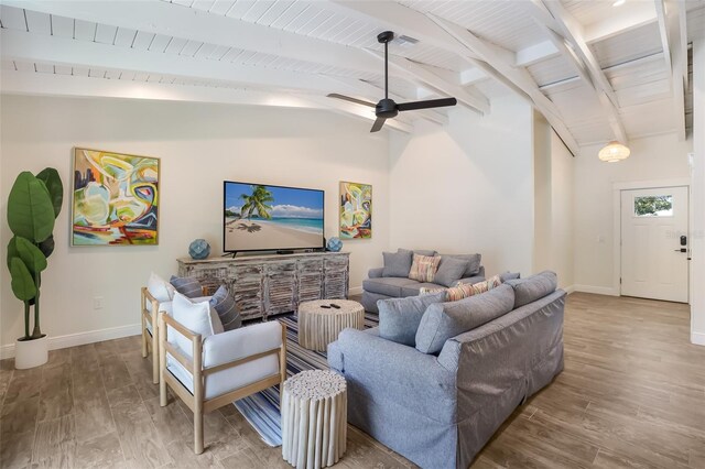 305 73rd St, Holmes Beach, FL 34217 - living area featuring baseboards, vaulted ceiling with beams, wood finished floors, and ceiling fan
