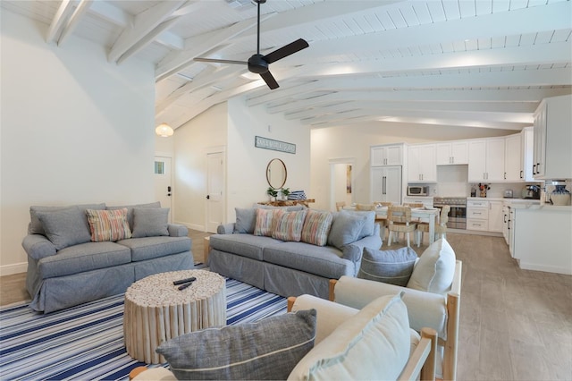 305 73rd St, Holmes Beach, FL 34217 - living area with light wood-style flooring, vaulted ceiling with beams, baseboards, and ceiling fan